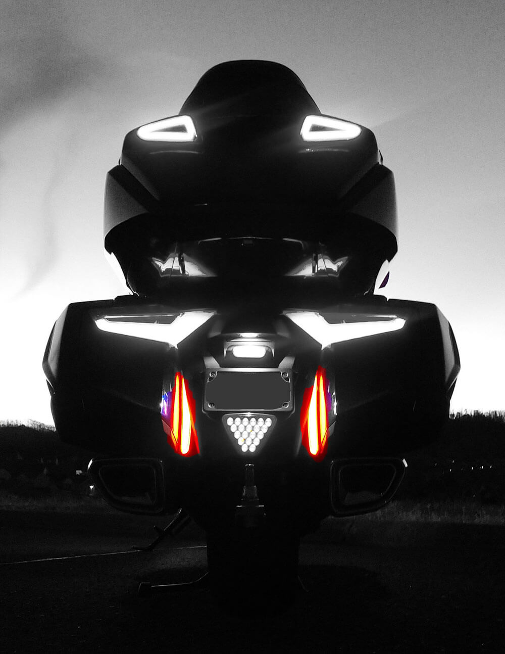 Image is the rear of the Honda Goldwing 2018+ in black and white showing the Fender Fill Lights in red.