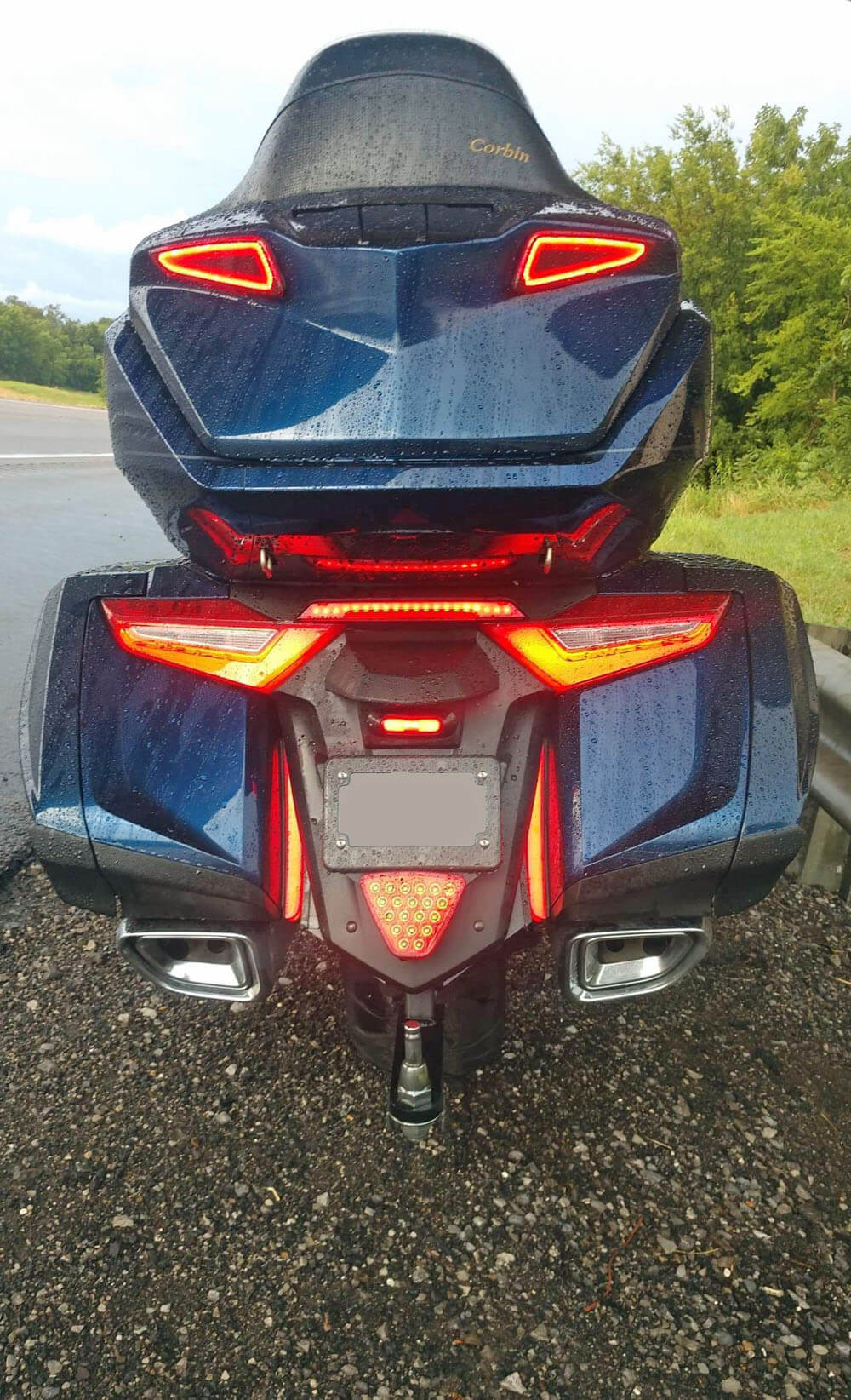 Image shows the 2018+ Honda Goldwing on the side of the road with all lighting on.